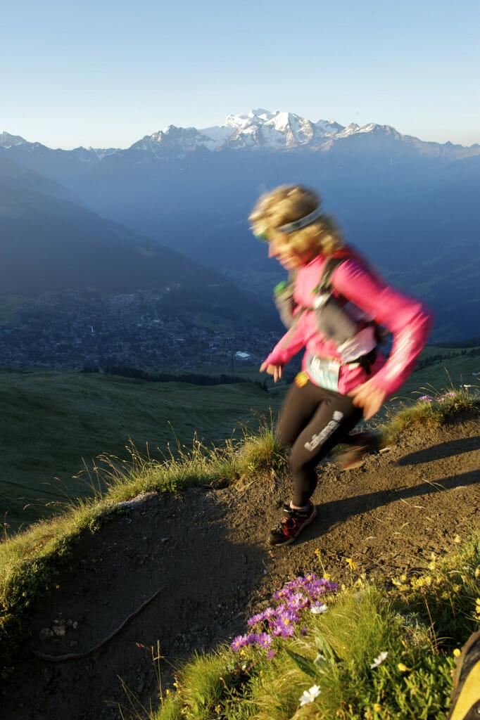 The sun rises over the Valais Canton, as runners descend from Pierre Avoi. 