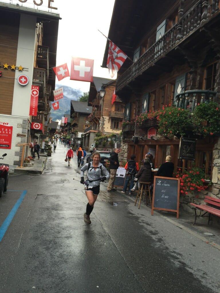 Karen wraps up the race with a smiling lap down the old village road in Champéry.