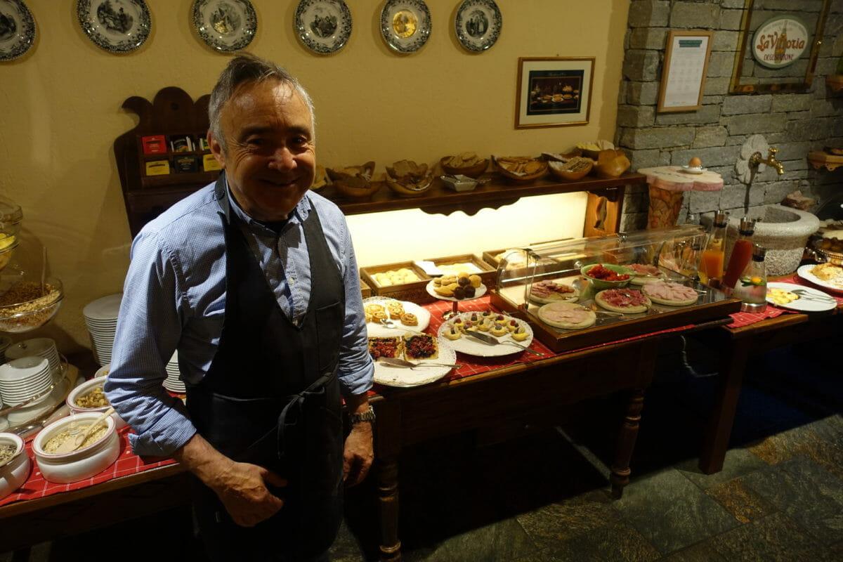 Hotel Bouton d'Or owner Andrea posing with his pastries