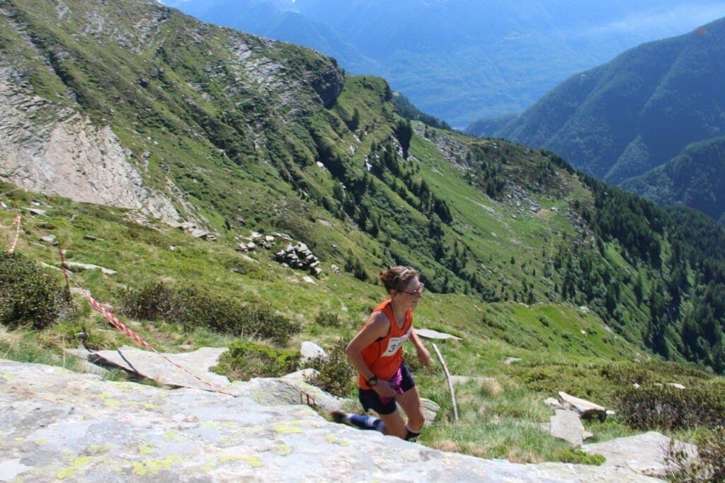 Emmie Collinge grinds out the vertical on the Londrino-Lavertezzo course. 