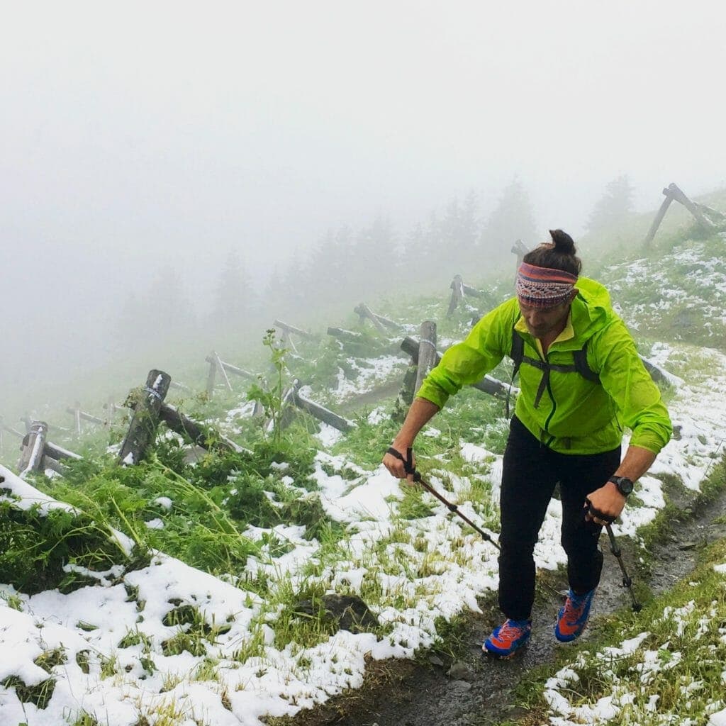 Zach heads into the snow zone, as the trail skirts avalanche anchors and barriers. 