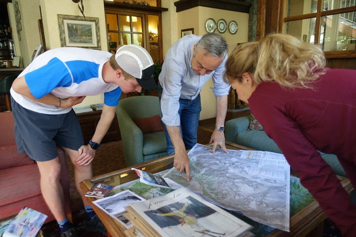 Hotel Bouton d'Or owner Andrea pointing to a map of the area (Photo: Jordyn Milbrath.)