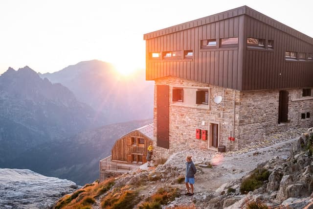 Courtney Dauwalter watching the sun set at the Refuge Albert Premier in the Chamonix valley