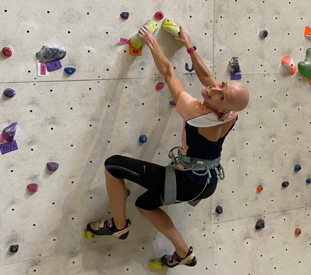 Steph Lightfoot climbing at a climbing wall