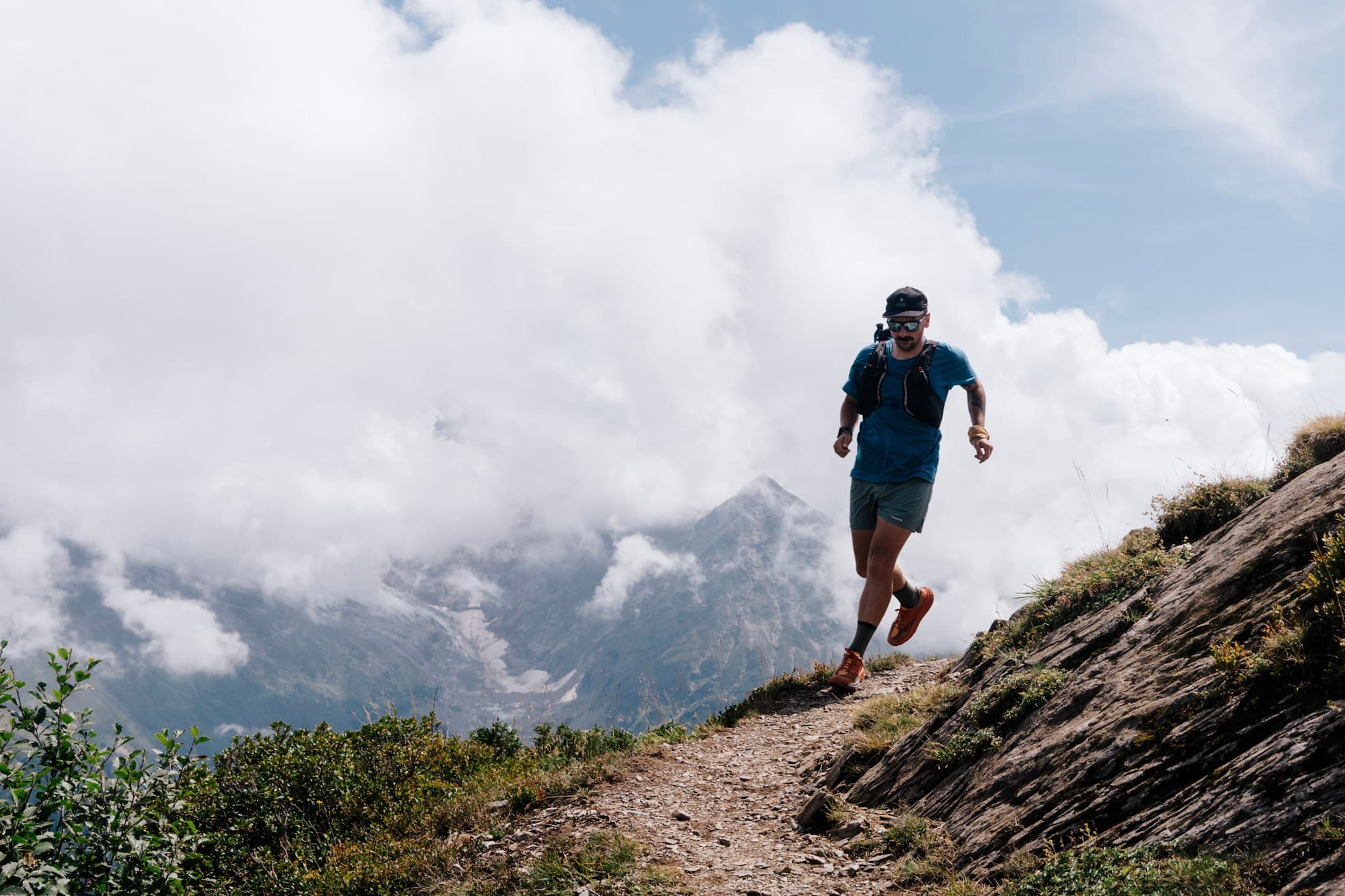 Runner coming around corner on single track