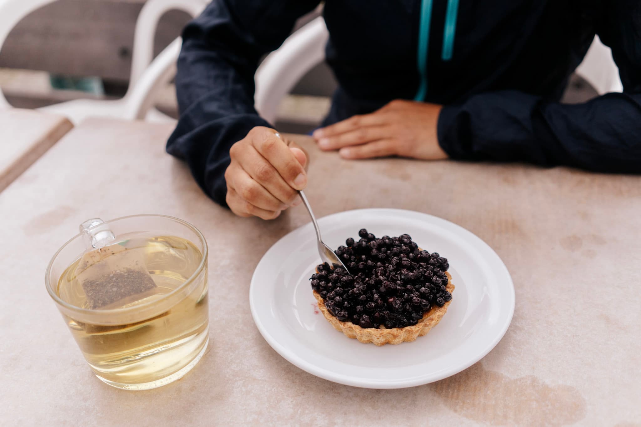 Blueberry tart and cup of tea at mountain cafe