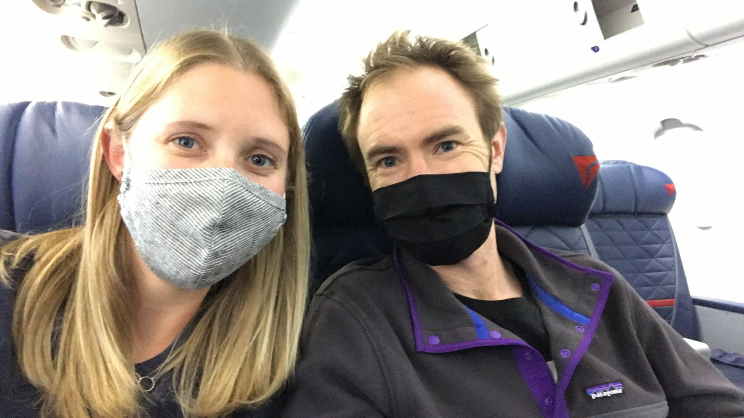 Mike and Steph with masks in plane