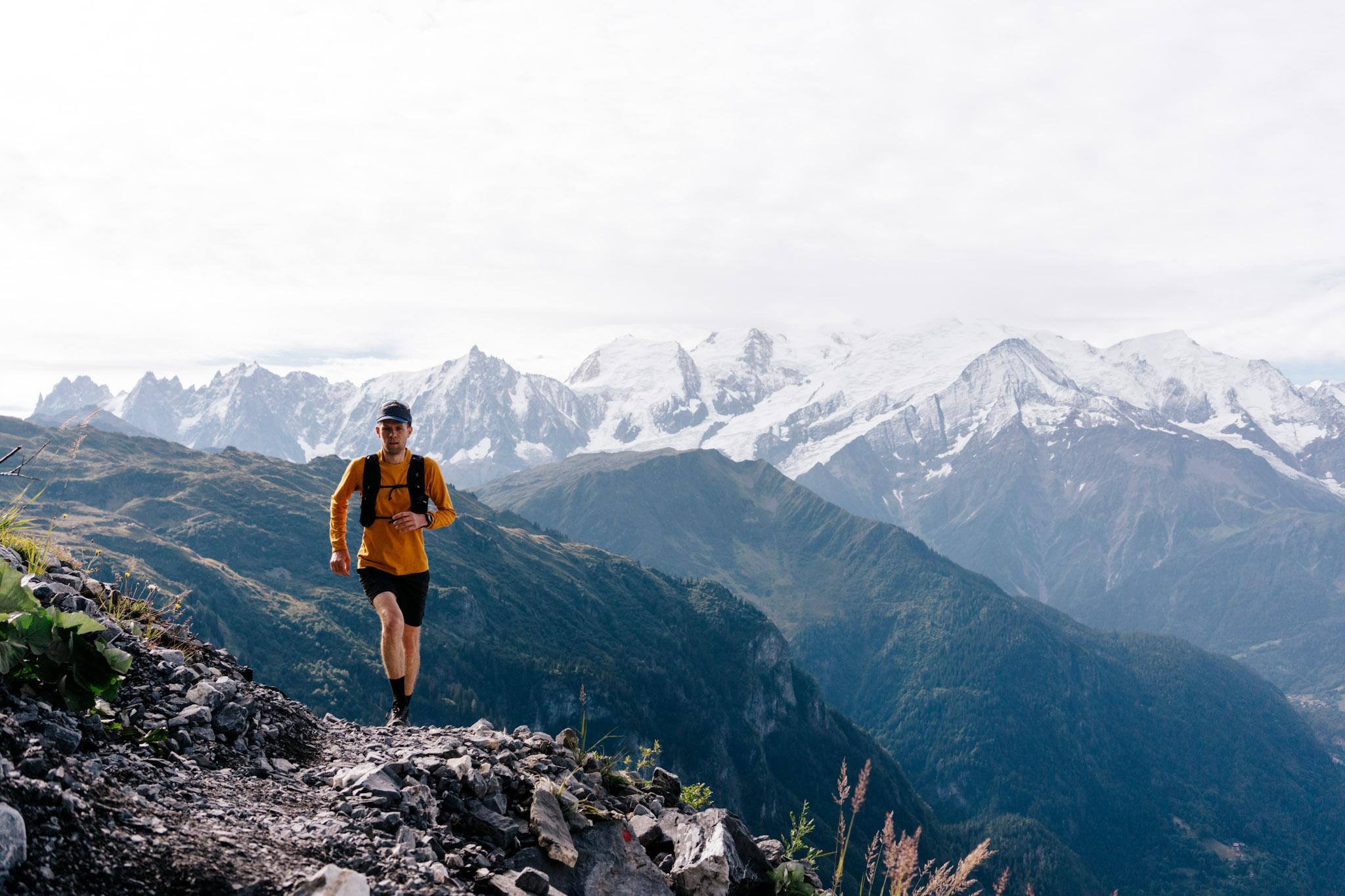 one runner runs up the trail