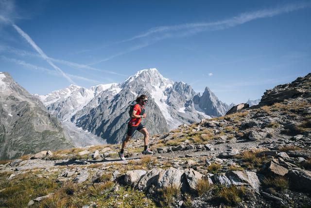 A male trail runner in the Aosta valley with Mont Blanc in the background