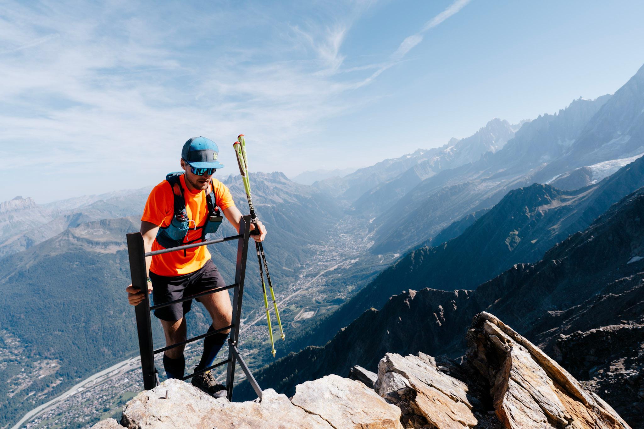 Runner climbs ladder on technical trail