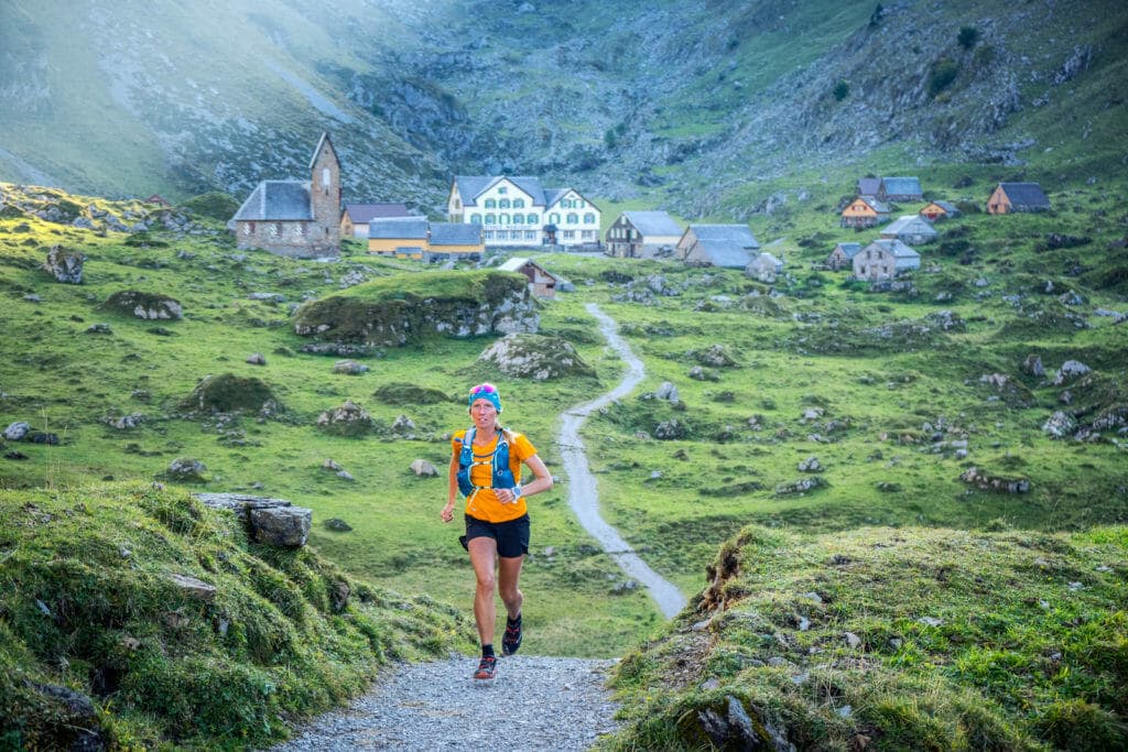 Trail running through the old dairy farm village of Meglisalp, in the Alpstein mountain region of eastern Switzerland.