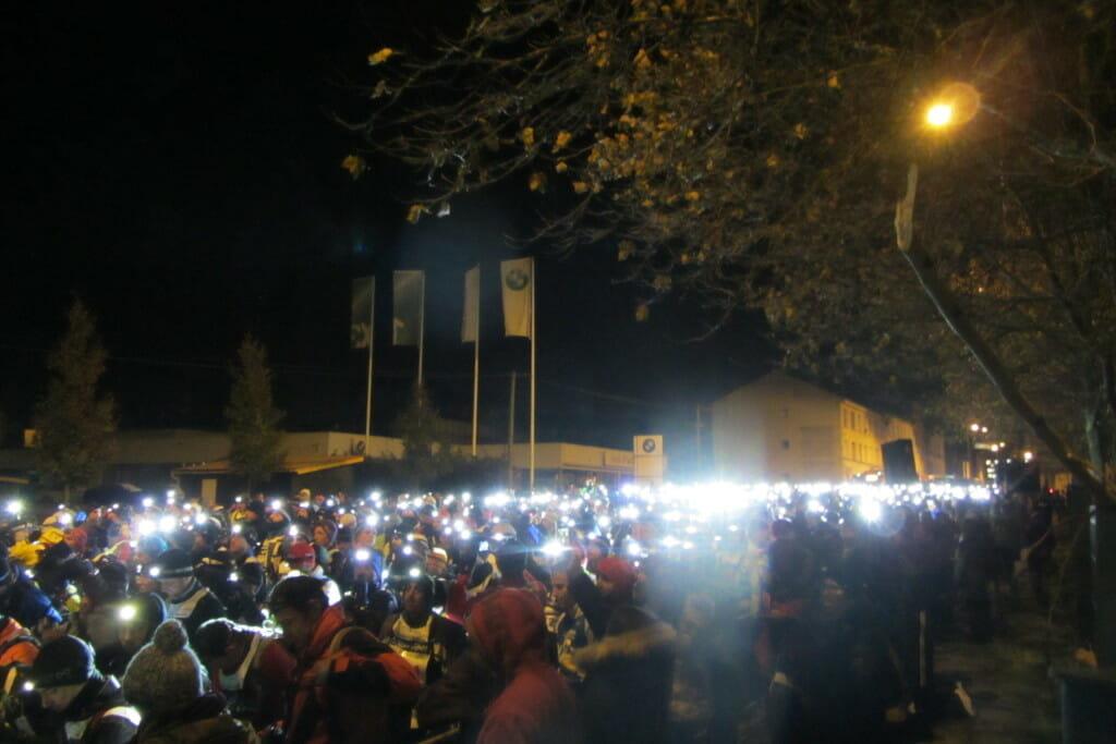 A sea of headlamps light up the midnight start in the village of St Etienne.