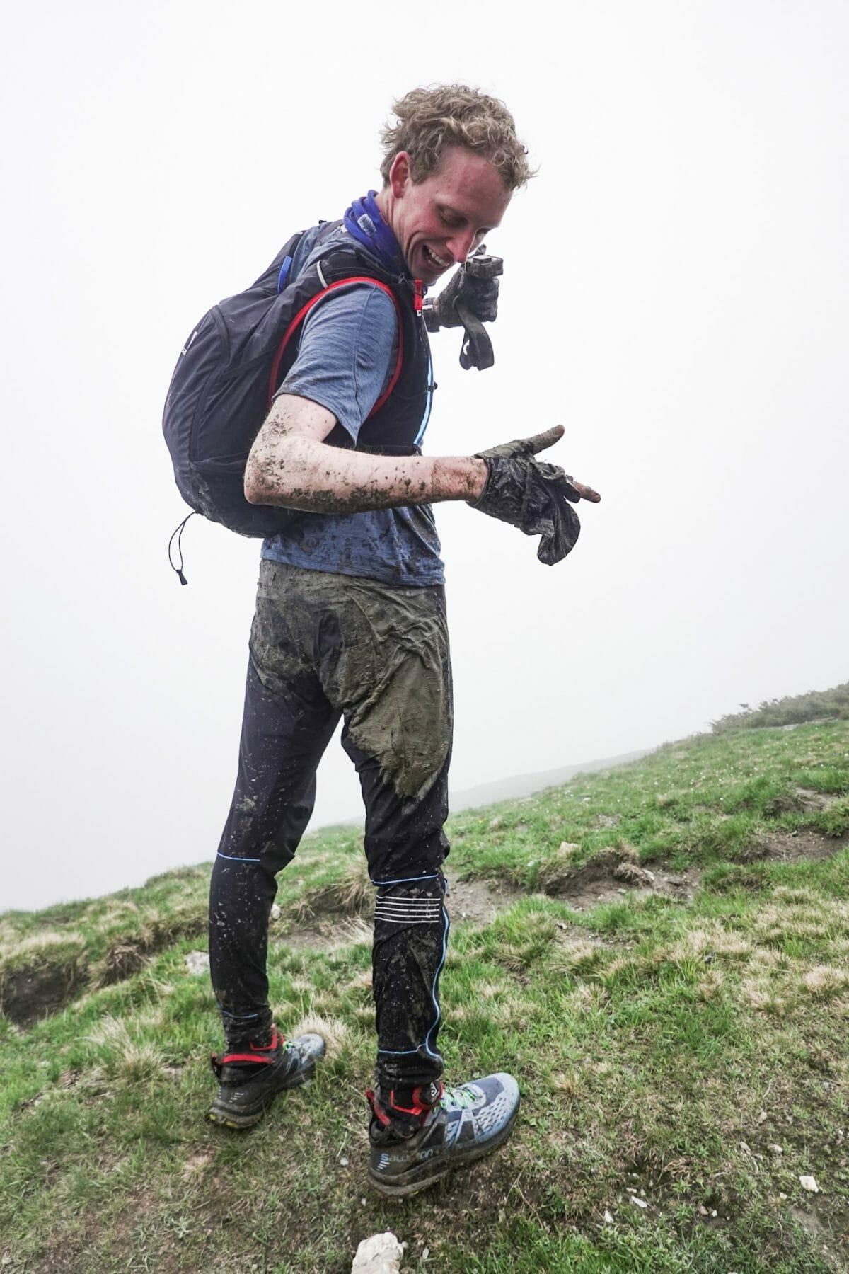 Max Romey covered in Mud below Grand Col Ferret (Photo: Chase Willie)
