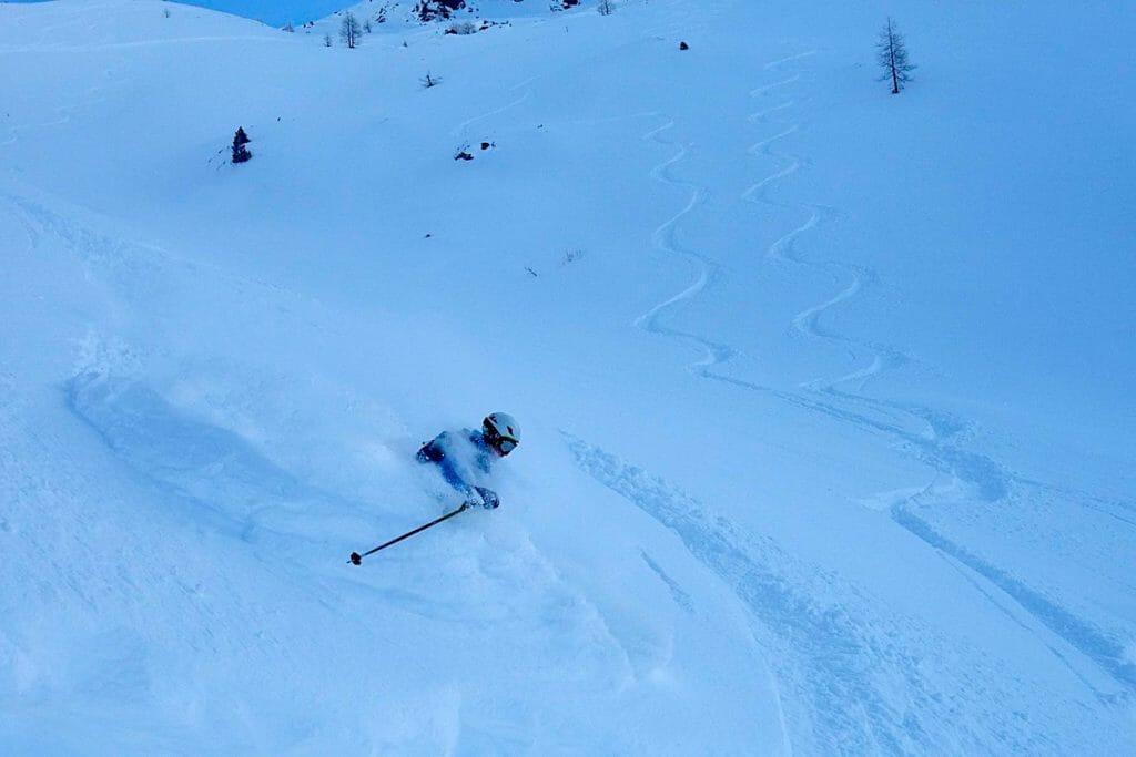 Grant Fulton skiing in deep powder
