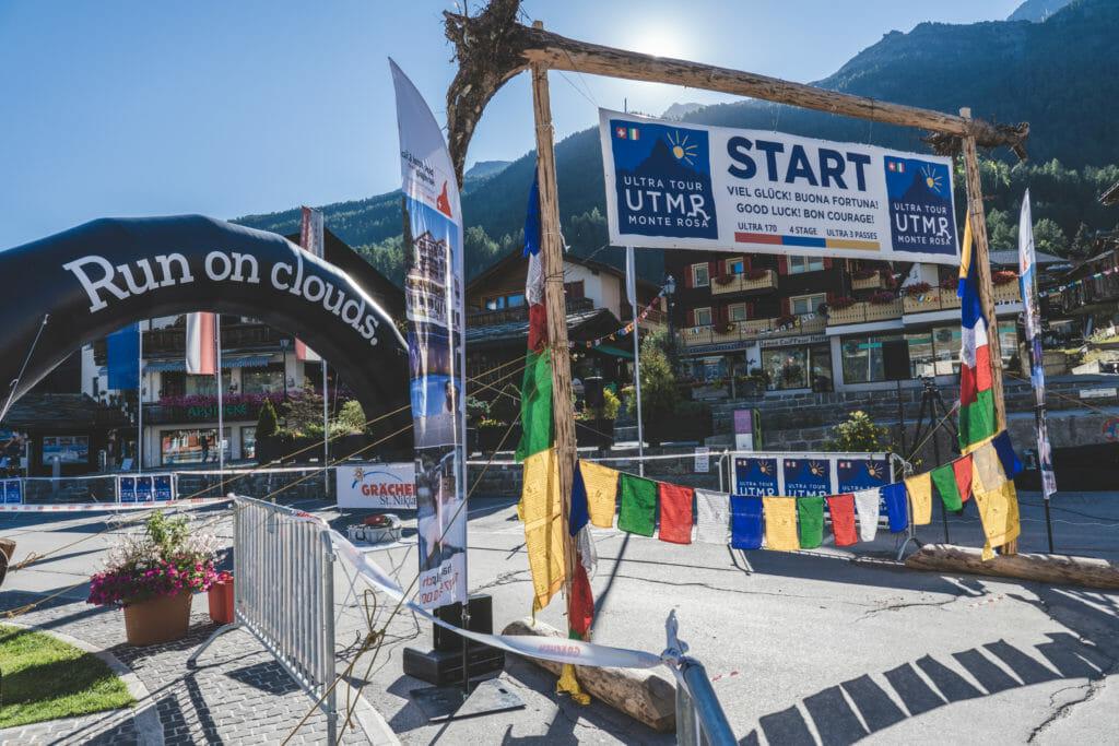 Start of Ultra Tour Monte Rosa with starting arc and Nepalese flags