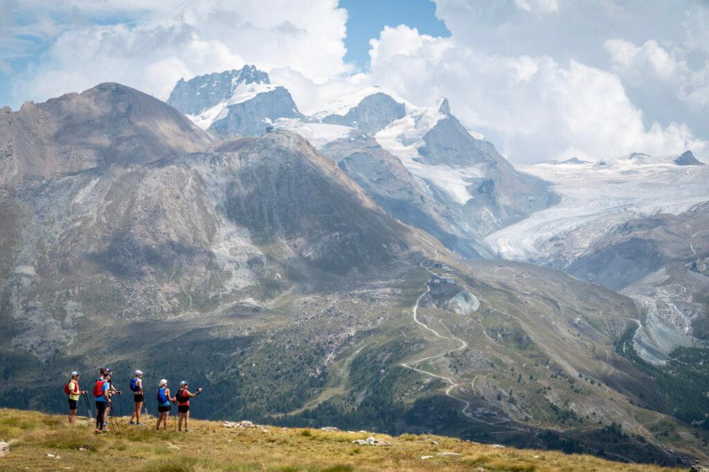 group of runners looking at view Zermatt