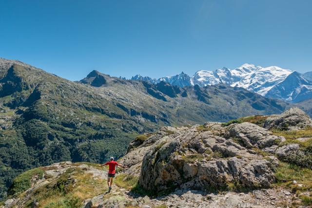 Trail runner in the Aiguilles Rouges, with Mont Blanc in the background