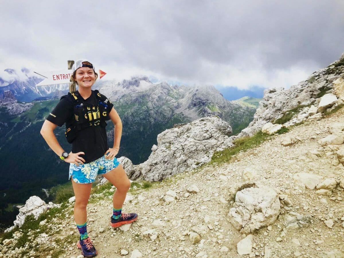 Female trail runner in colorful shorts posing