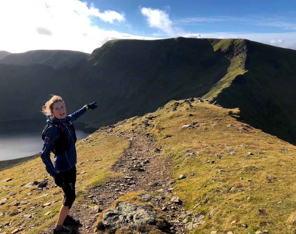 Heather Ohly pointing at a ridge on Helvellyn, Lake District, UK