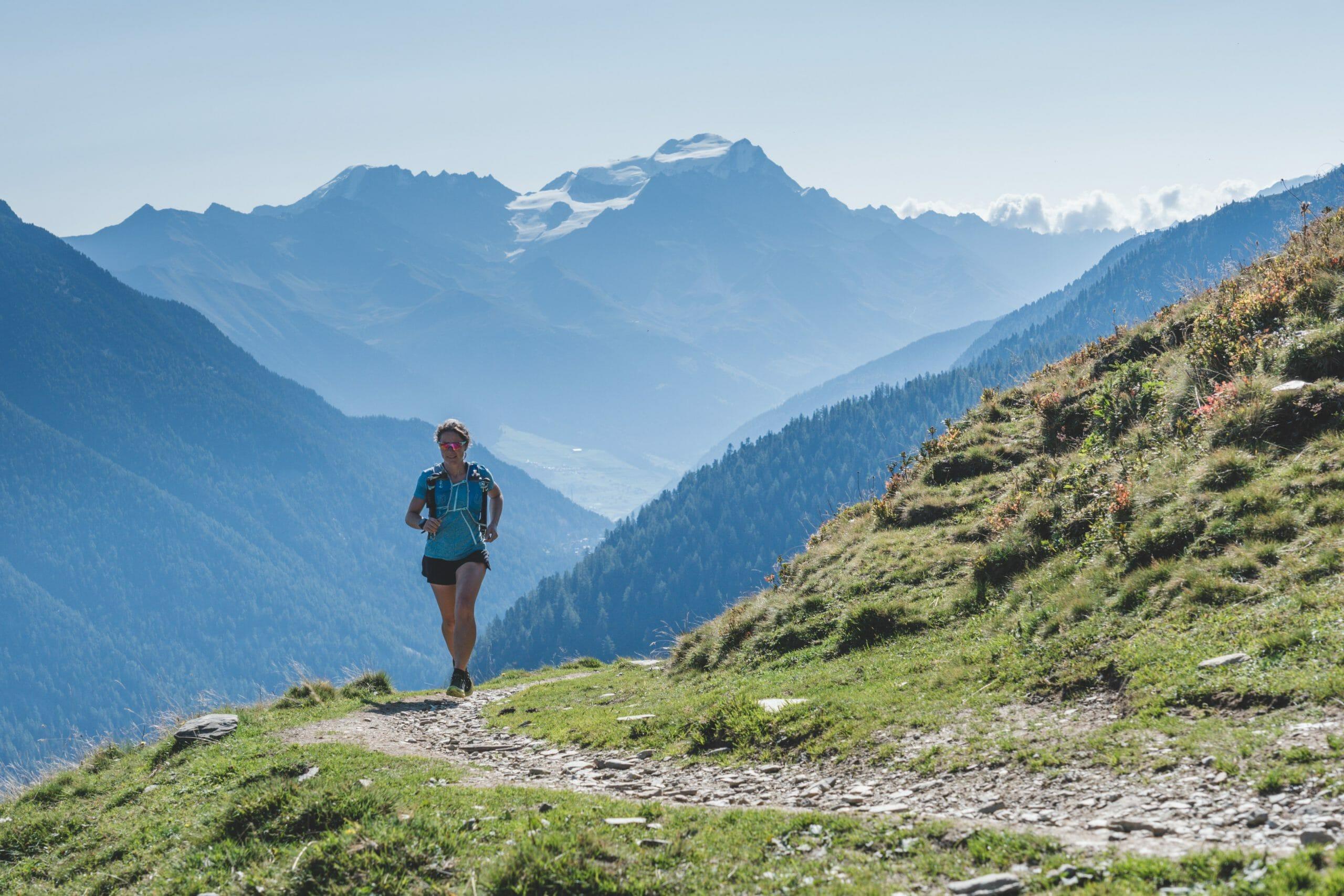 Femail trail runner above Champex Lac Switzerland
