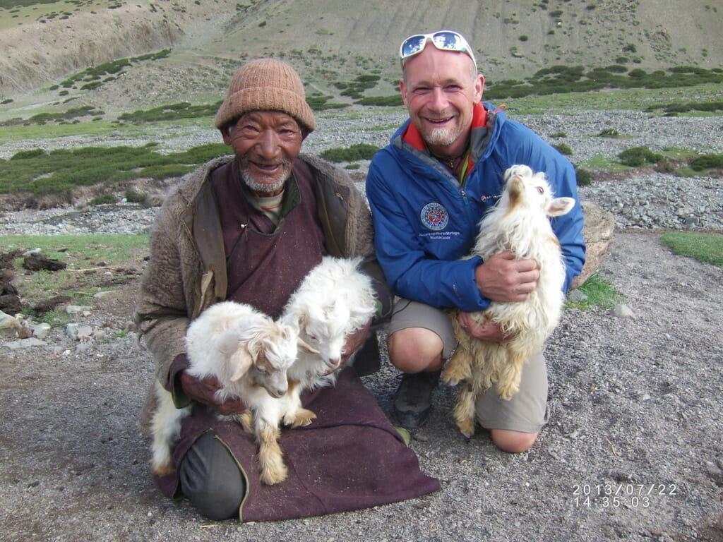 Gary Daines in the Shangphu Valley with a local Indian guy, holding goats