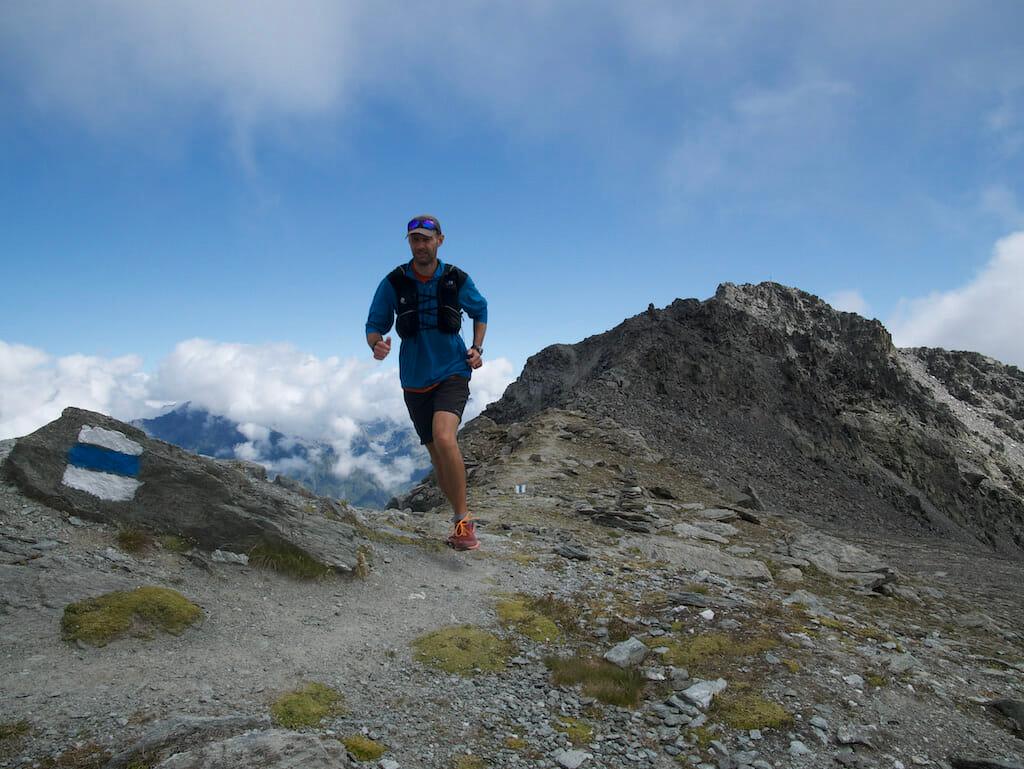 Sandy Miller running along a ridgeline on Mont Rogneux in the Valais, Switzerland