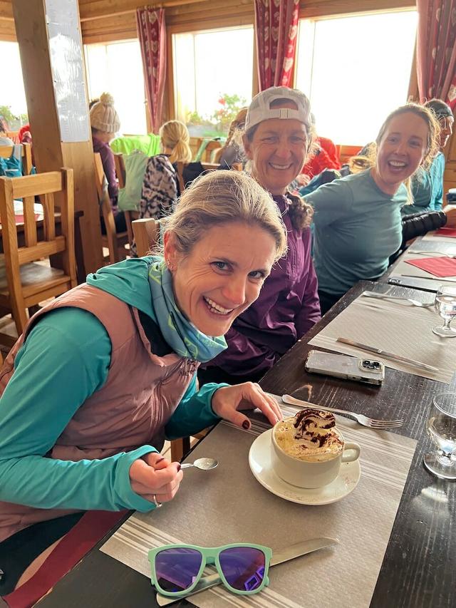 Trail runners enjoying hot chocolate at the Refuge Plan de L'Aiguille, Chamonix