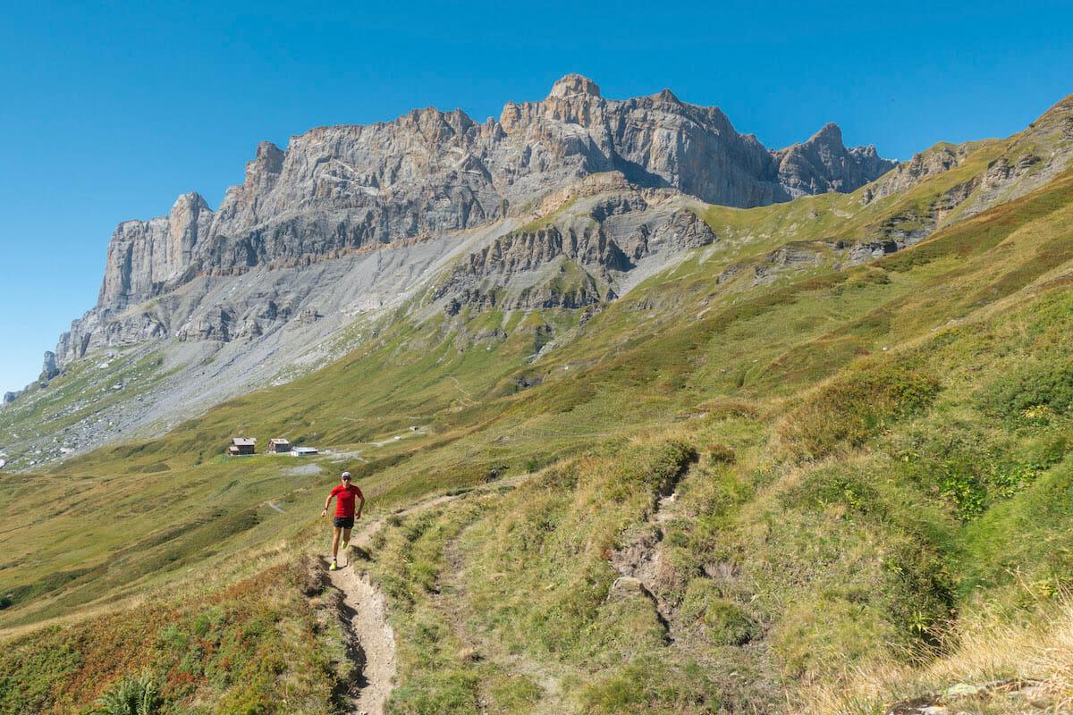 Trail runner in the Aiguilles Rouges, with the Fiz mountains behind.