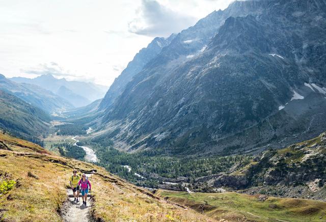 Two trail runners in Italy's Val Ferret on the way to the Grand Col Ferret