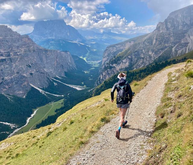 A trail runner above Vallunga in the Dolomites